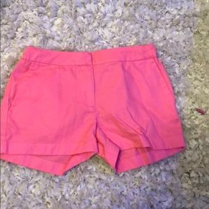 Hot pink shorts.